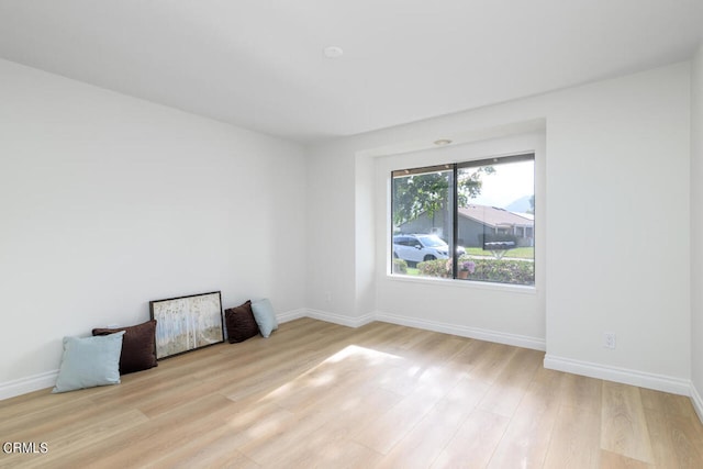 spare room featuring light hardwood / wood-style flooring