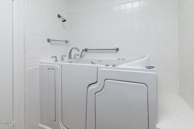 laundry room featuring tile walls