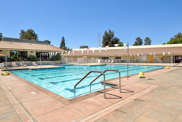 view of swimming pool featuring a patio