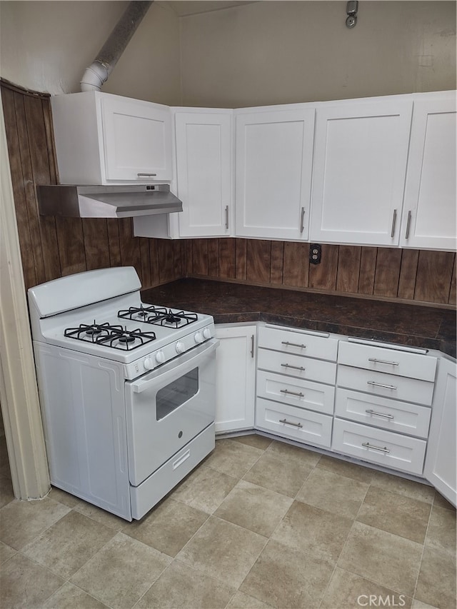 kitchen featuring white gas range, exhaust hood, and white cabinetry