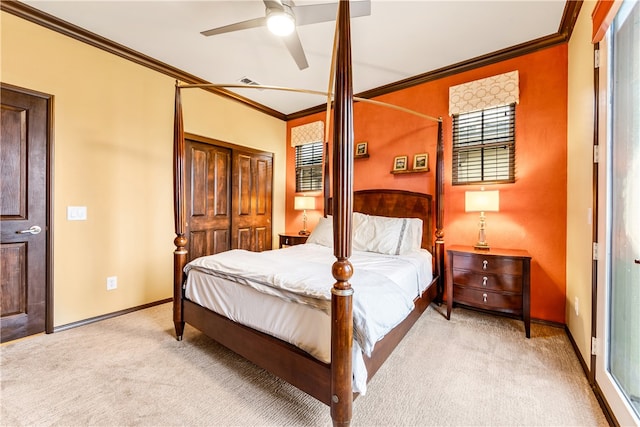 bedroom featuring light carpet, ornamental molding, and ceiling fan