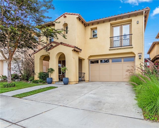 mediterranean / spanish-style house featuring a garage