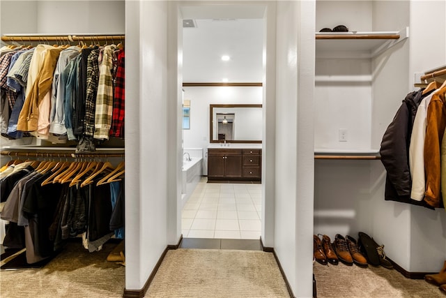 spacious closet with light tile patterned flooring