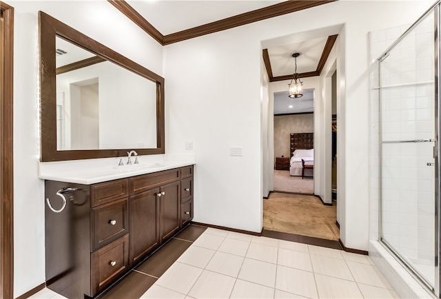 bathroom featuring vanity, crown molding, tile patterned floors, and a shower with shower door