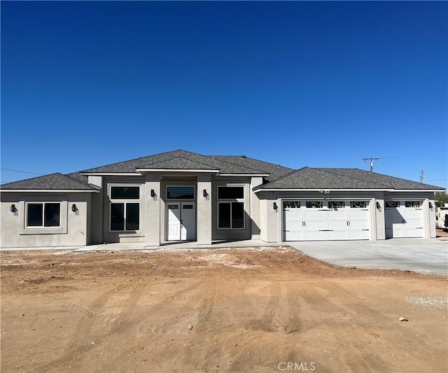 prairie-style house featuring a garage