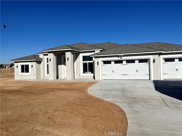 prairie-style house featuring a garage