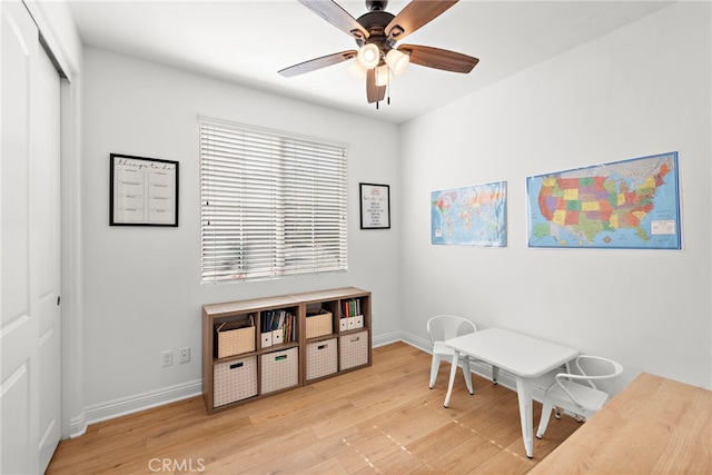 office featuring light hardwood / wood-style floors and ceiling fan