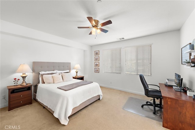 bedroom featuring ceiling fan and light carpet