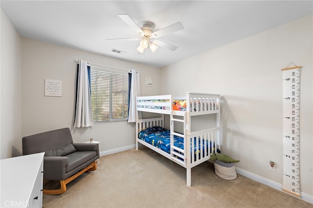 bedroom with light carpet and ceiling fan