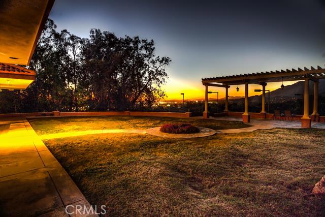 yard at dusk featuring a pergola