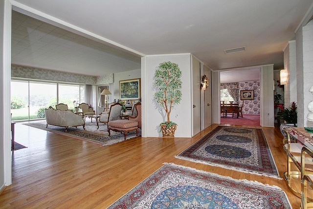 corridor featuring hardwood / wood-style floors