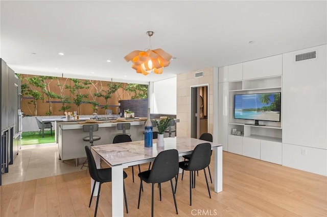 dining room featuring light hardwood / wood-style floors