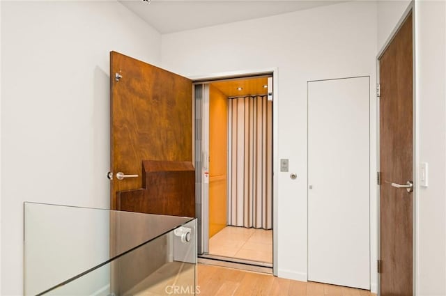 hall featuring light hardwood / wood-style flooring