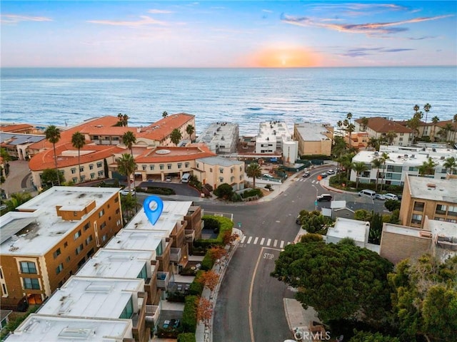 aerial view at dusk with a water view