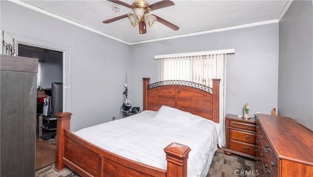 carpeted bedroom with crown molding and ceiling fan