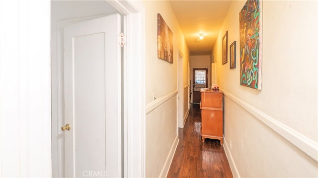 corridor featuring dark hardwood / wood-style floors