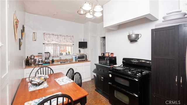 kitchen featuring a chandelier, sink, and black appliances