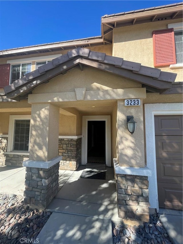 property entrance with a garage