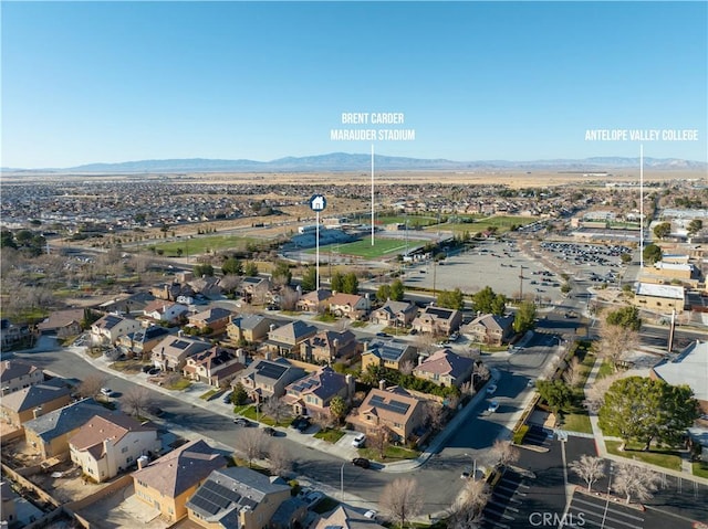 birds eye view of property with a residential view and a mountain view