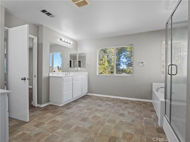 bathroom with a bath, a shower stall, visible vents, and a wealth of natural light