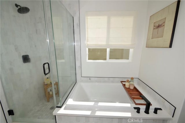 bathroom featuring plus walk in shower