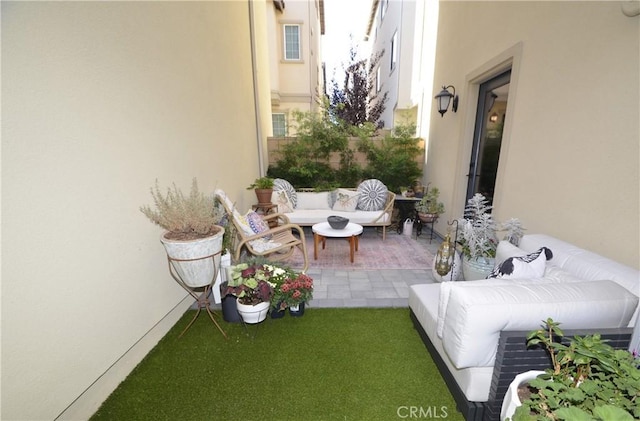 balcony featuring a patio area and an outdoor hangout area