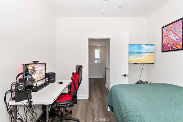 bedroom featuring dark hardwood / wood-style flooring