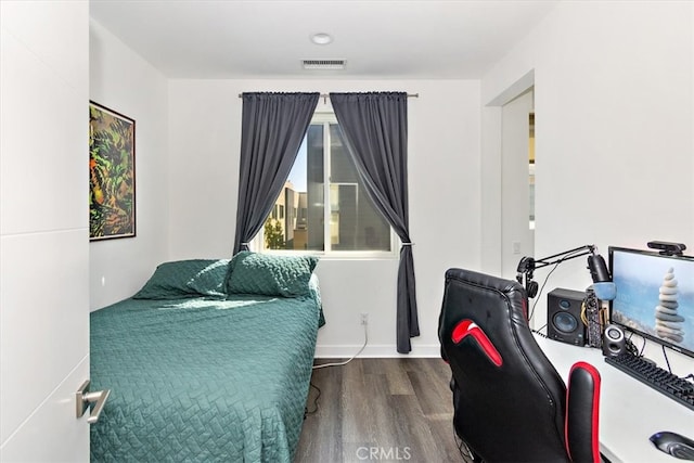 bedroom featuring wood-type flooring