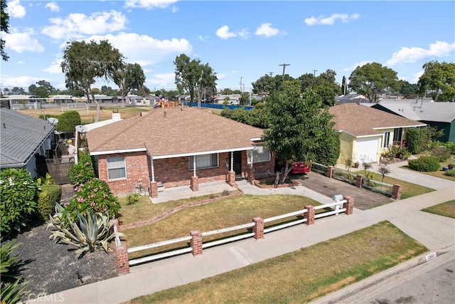 ranch-style home with a front lawn