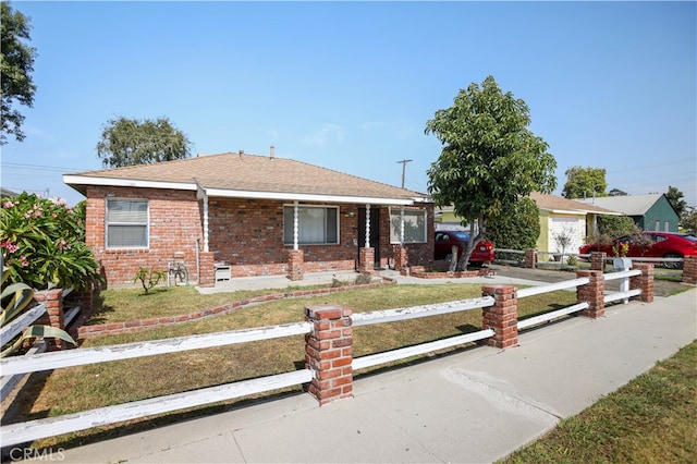 view of front facade with a garage and a front lawn