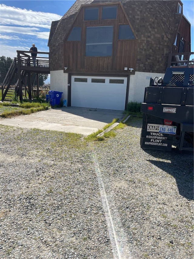 view of property exterior with a garage