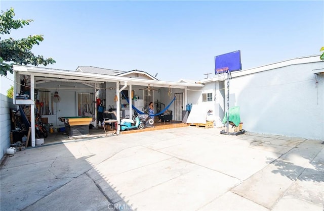 rear view of property featuring a patio