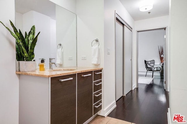 bathroom featuring vanity and wood-type flooring