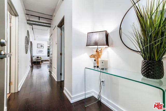 hallway featuring dark hardwood / wood-style flooring