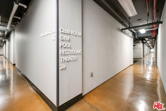 hallway featuring concrete flooring