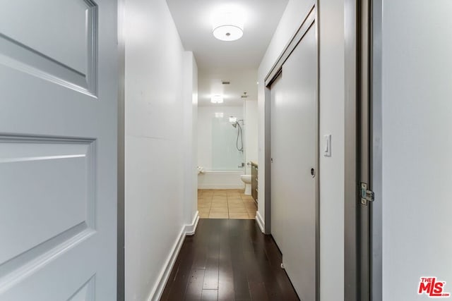 corridor featuring wood-type flooring