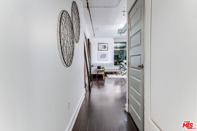 corridor featuring dark hardwood / wood-style flooring