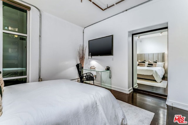 bedroom featuring dark hardwood / wood-style floors