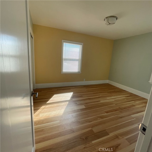 empty room with light wood-type flooring