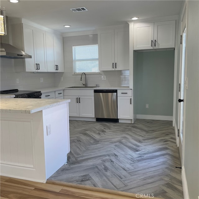 kitchen with wall chimney exhaust hood, sink, stainless steel dishwasher, and white cabinets