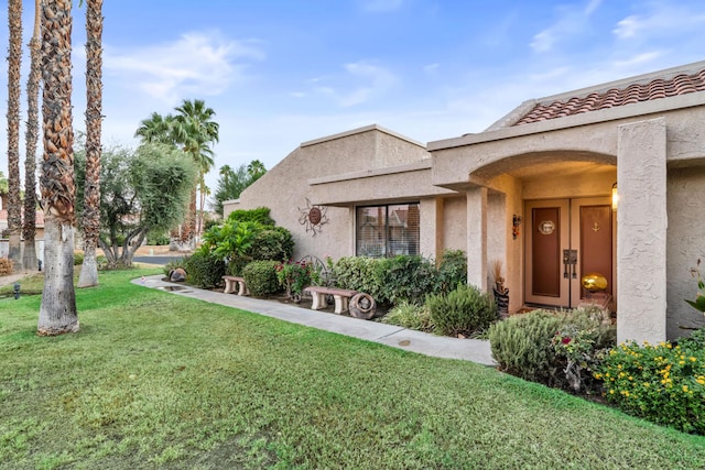 exterior space featuring a front lawn