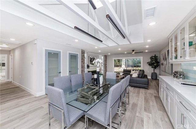 dining space featuring ceiling fan and light hardwood / wood-style flooring