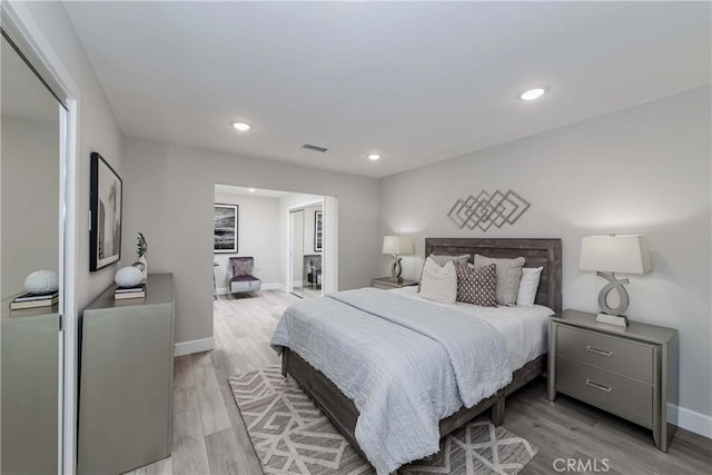 bedroom featuring a closet and light hardwood / wood-style floors