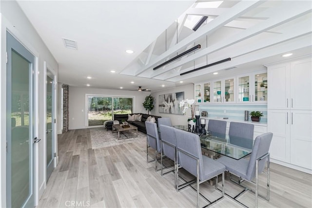 dining room with light wood-type flooring and ceiling fan