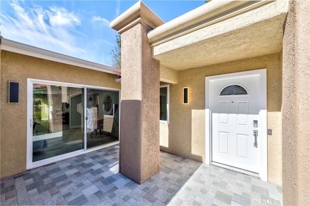 doorway to property with a patio