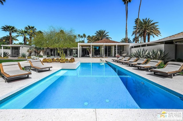 view of swimming pool with a patio area