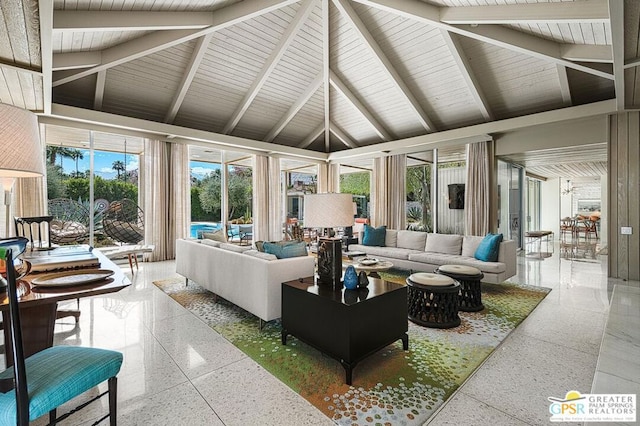 living room with high vaulted ceiling and beam ceiling