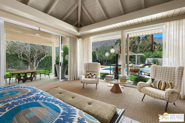 sunroom featuring vaulted ceiling with beams and wooden ceiling