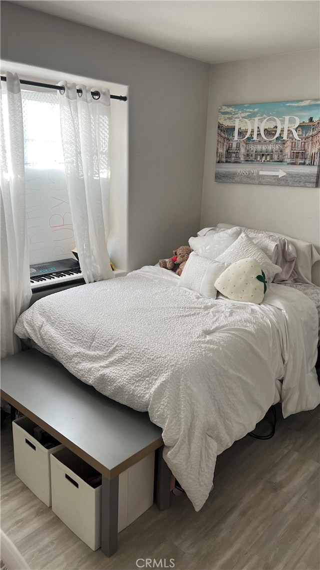 bedroom featuring wood-type flooring