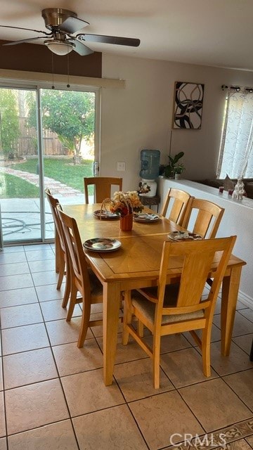 dining room with ceiling fan and light tile patterned flooring